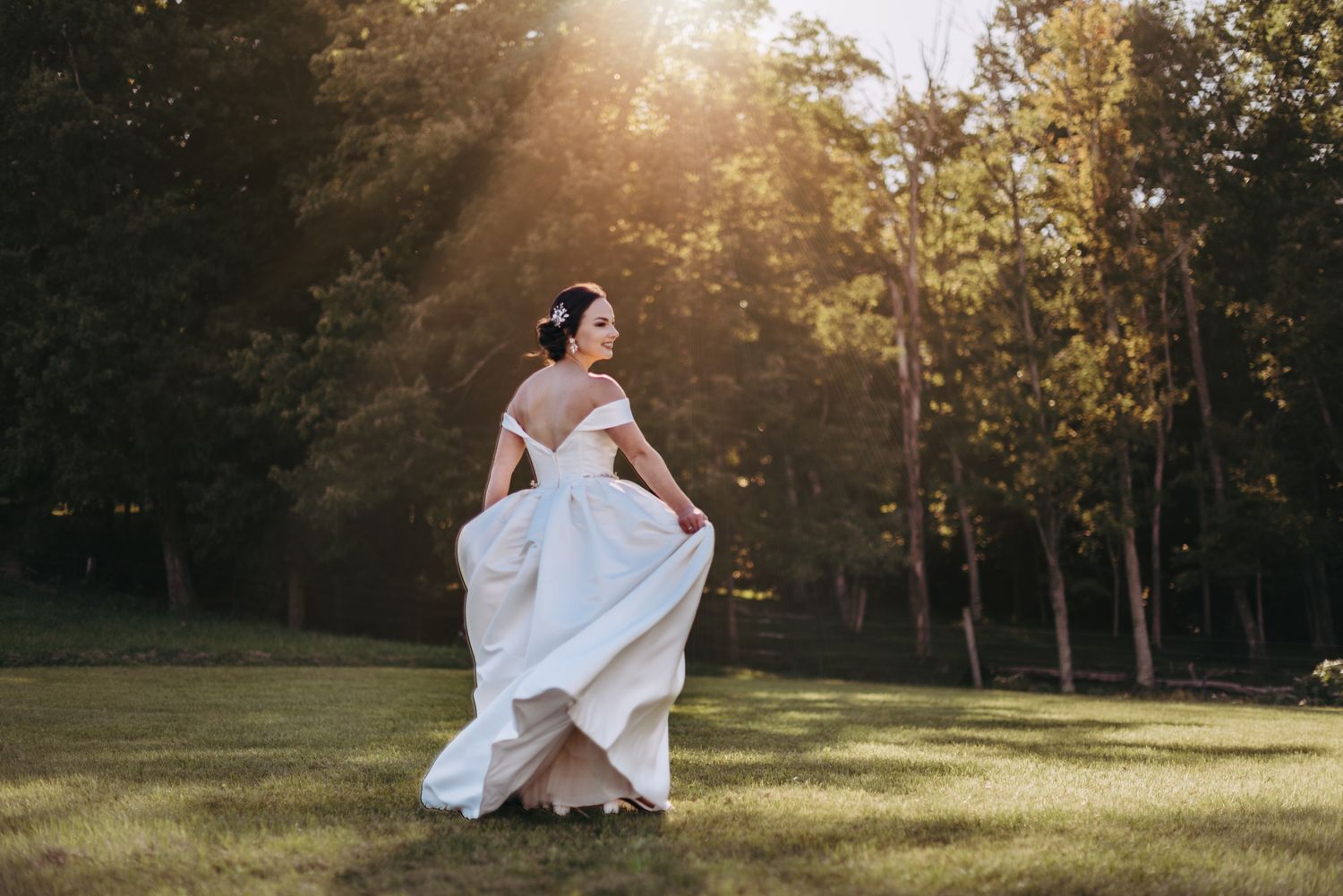 bride dancing under the sunlight