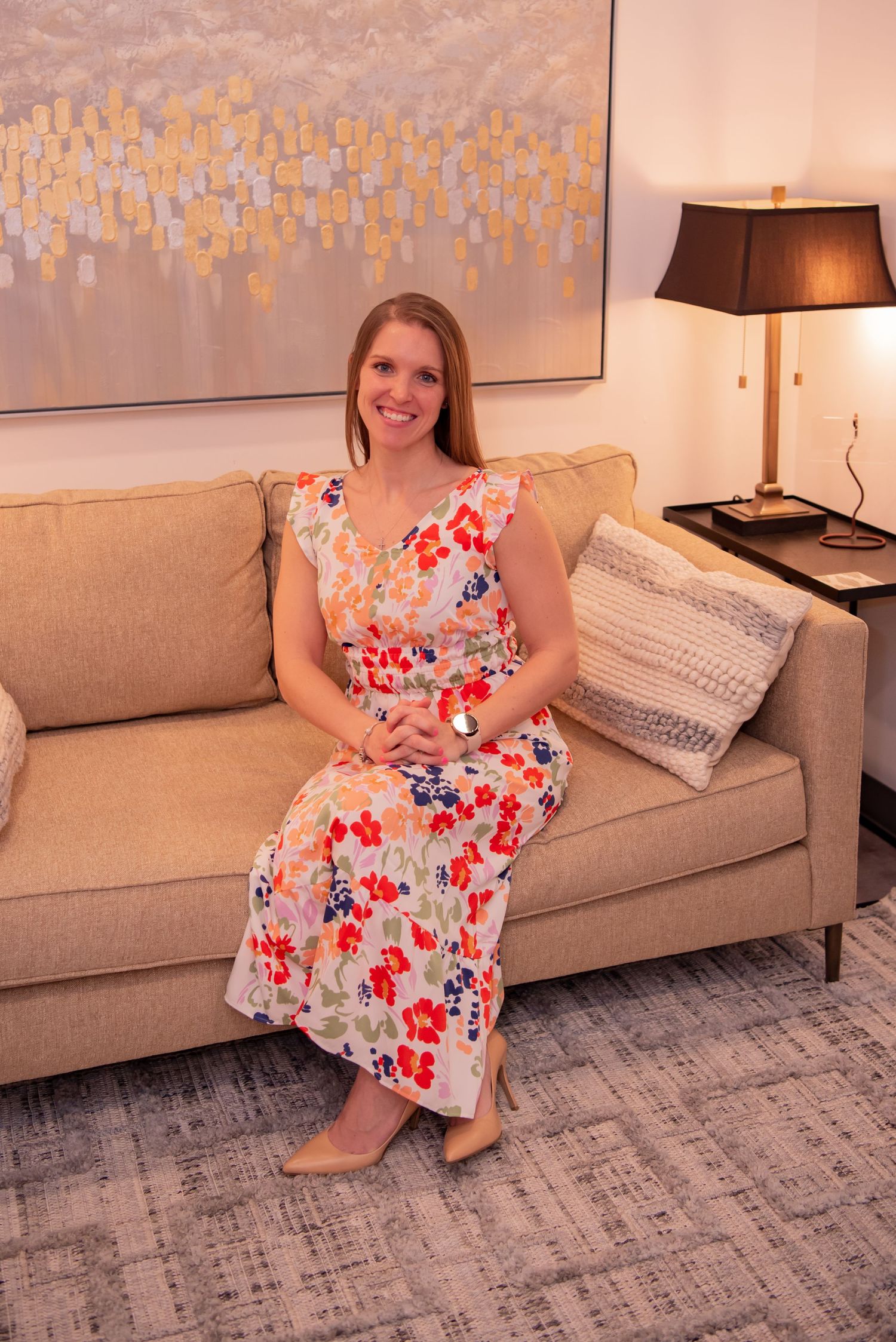 female doctor sitting on couch in office ashley loughner