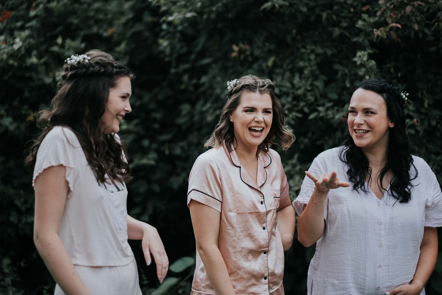brides mais in gowns laughing
