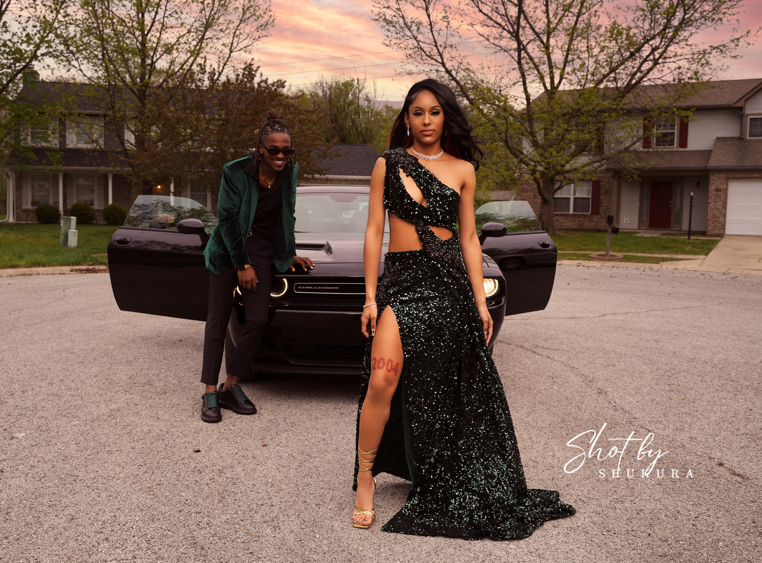 Evening fashion shoot with sparkly black gown and luxury car backdrop.