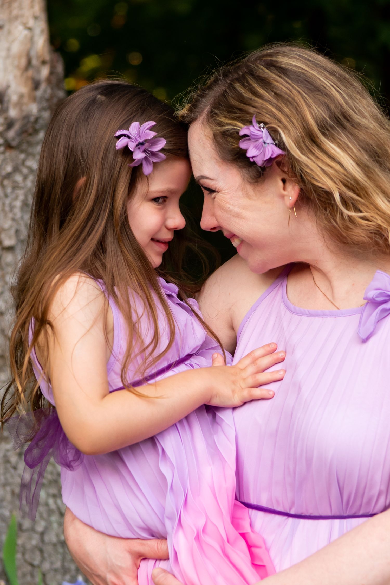 mom and young daughter in pink dresses