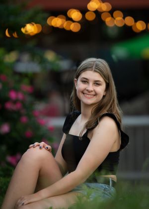Portrait with bokeh lights and flowers in evening garden setting. Senior Photographer Batavia Cincinnati Ohio