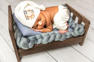 Newborn photo in bed