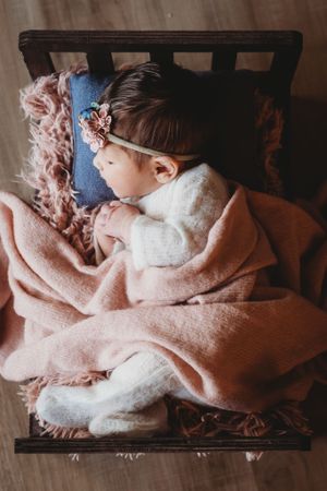 Newborn photo of baby girl in baby bed. Baltimore newborn photographer. Maryland newborn photographer. Annapolis newborn photographer