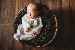 Posed newborn photo with props. Annapolis newborn photography. Annapolis newborn photographer