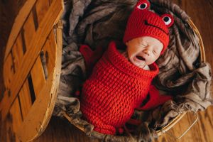 Newborn photo of baby boy as Maryland crab with props. Annapolis newborn photographer. Maryland newborn photographer