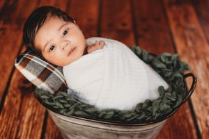 Swaddled newborn in bucket picture. Annapolis newborn photographer. Baltimore newborn photographer