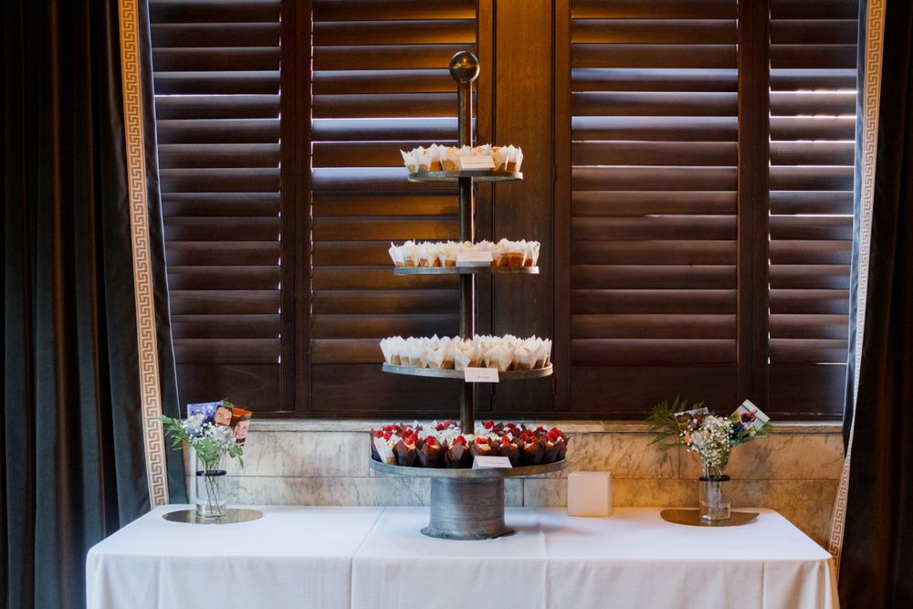 Wedding dessert table featuring tiered floating cake stands and floral decorations.