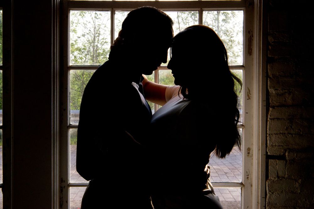 couple hugging and kissing. Old Hidalgo Pump House. Hidalgo, Texas. Wedding photographer