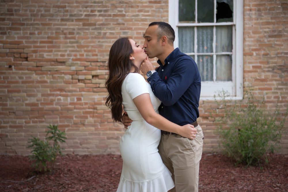engagement couple session. kissing. Old Hidalgo Pump House. Hidalgo, Texas. Wedding photographer