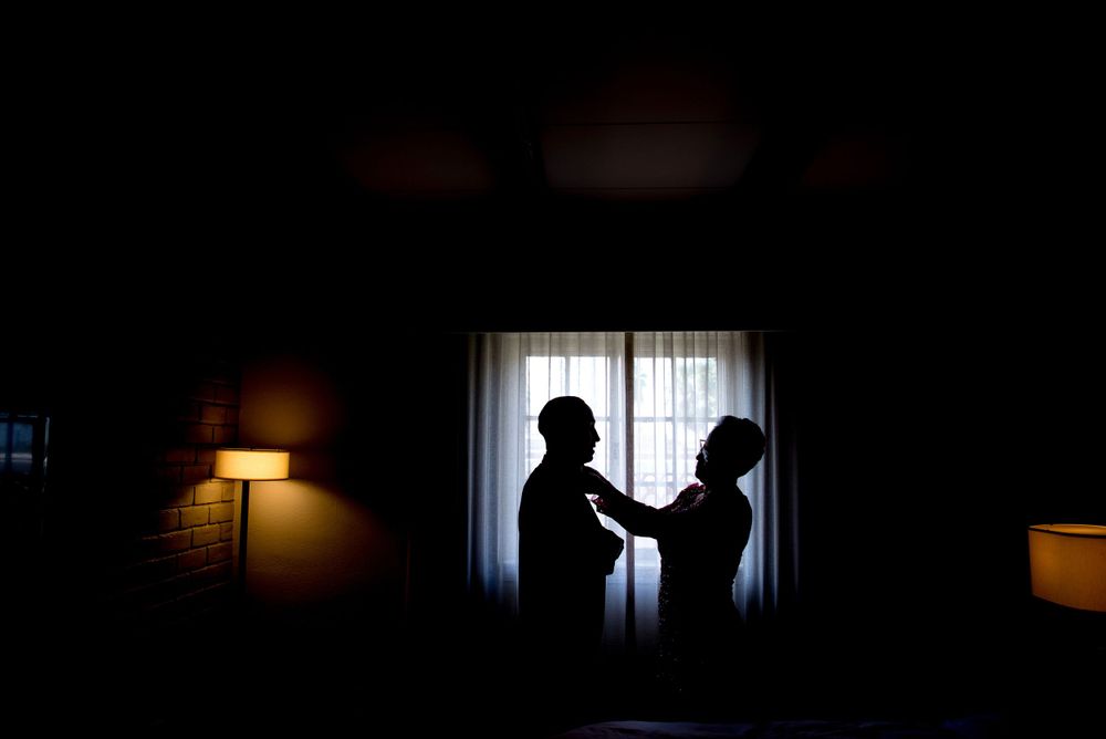 groom's getting ready. mother helping son getting dress. Casa De Palmas, Trademark Collection by Wyndham. Wedding photog