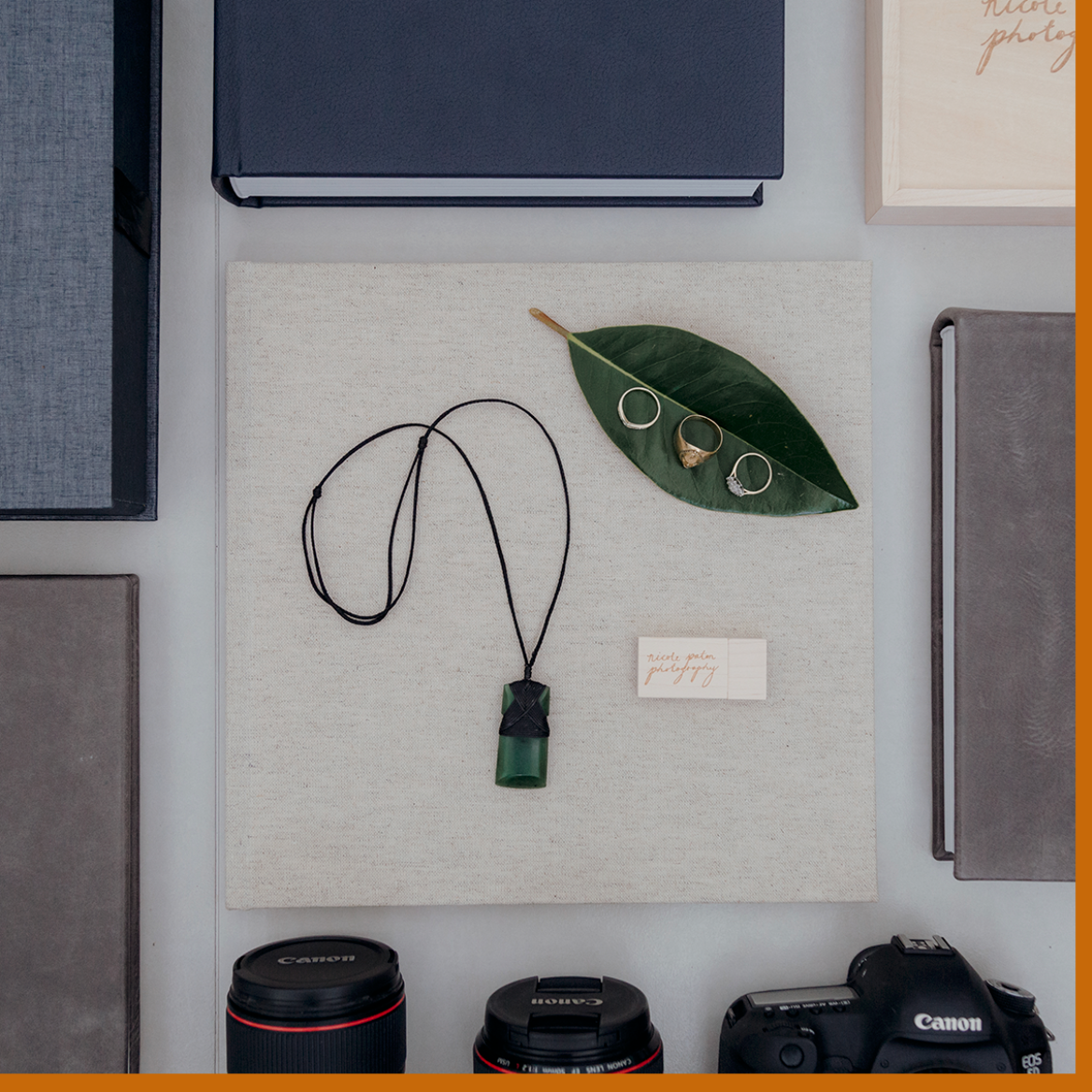 linen album with greenstone necklace and wedding rings