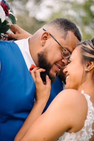 Intimate wedding portrait showing tender moment between couple.