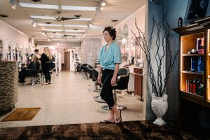 Interior of a salon with modern decor and lighting fixtures.