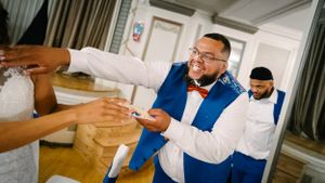 Wedding party members sharing snacks or treats during the reception festivities.