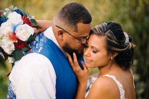 Romantic close-up of couple sharing intimate wedding day moment.