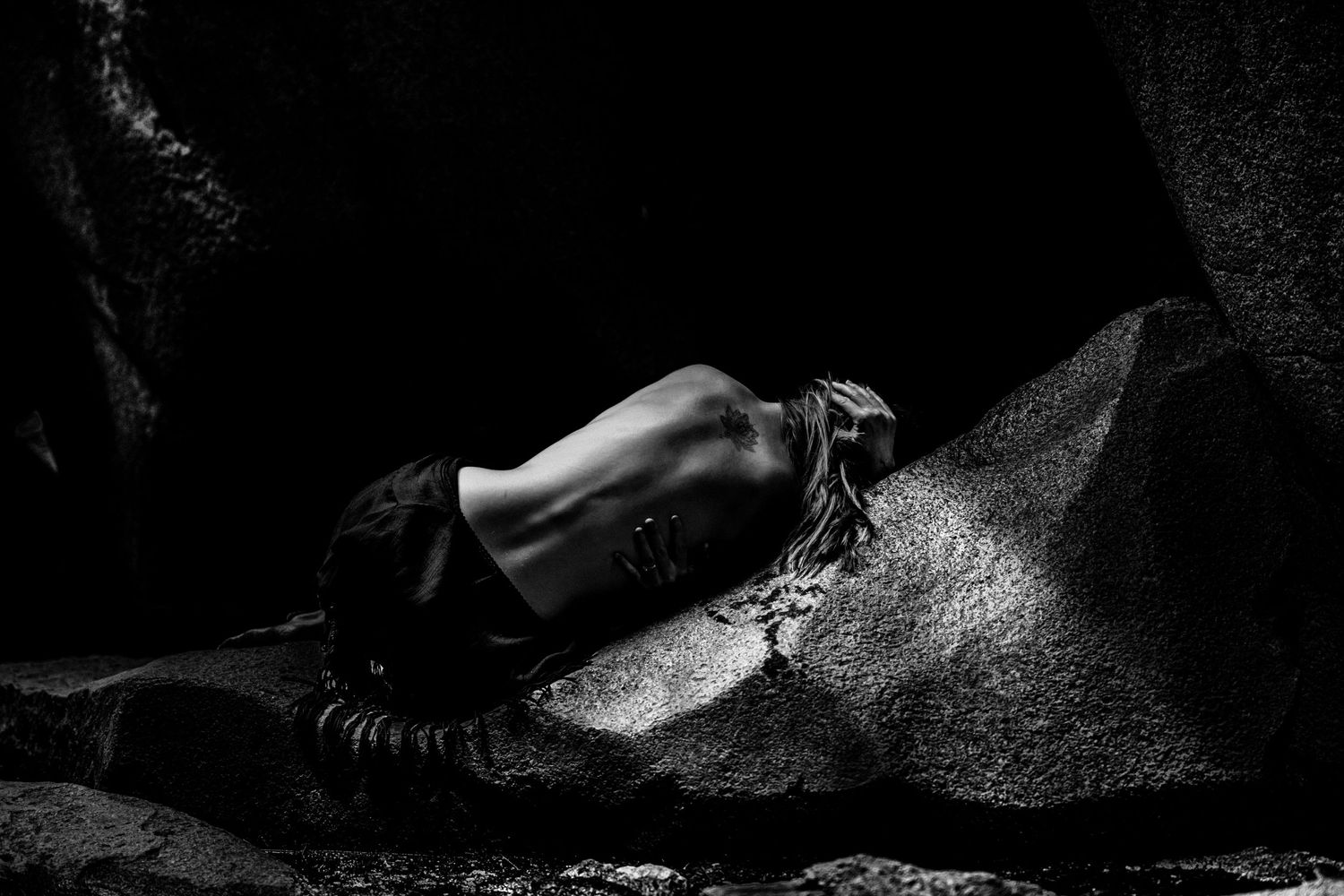 Artistic black and white portrait series with dramatic shadows and lighting effects.