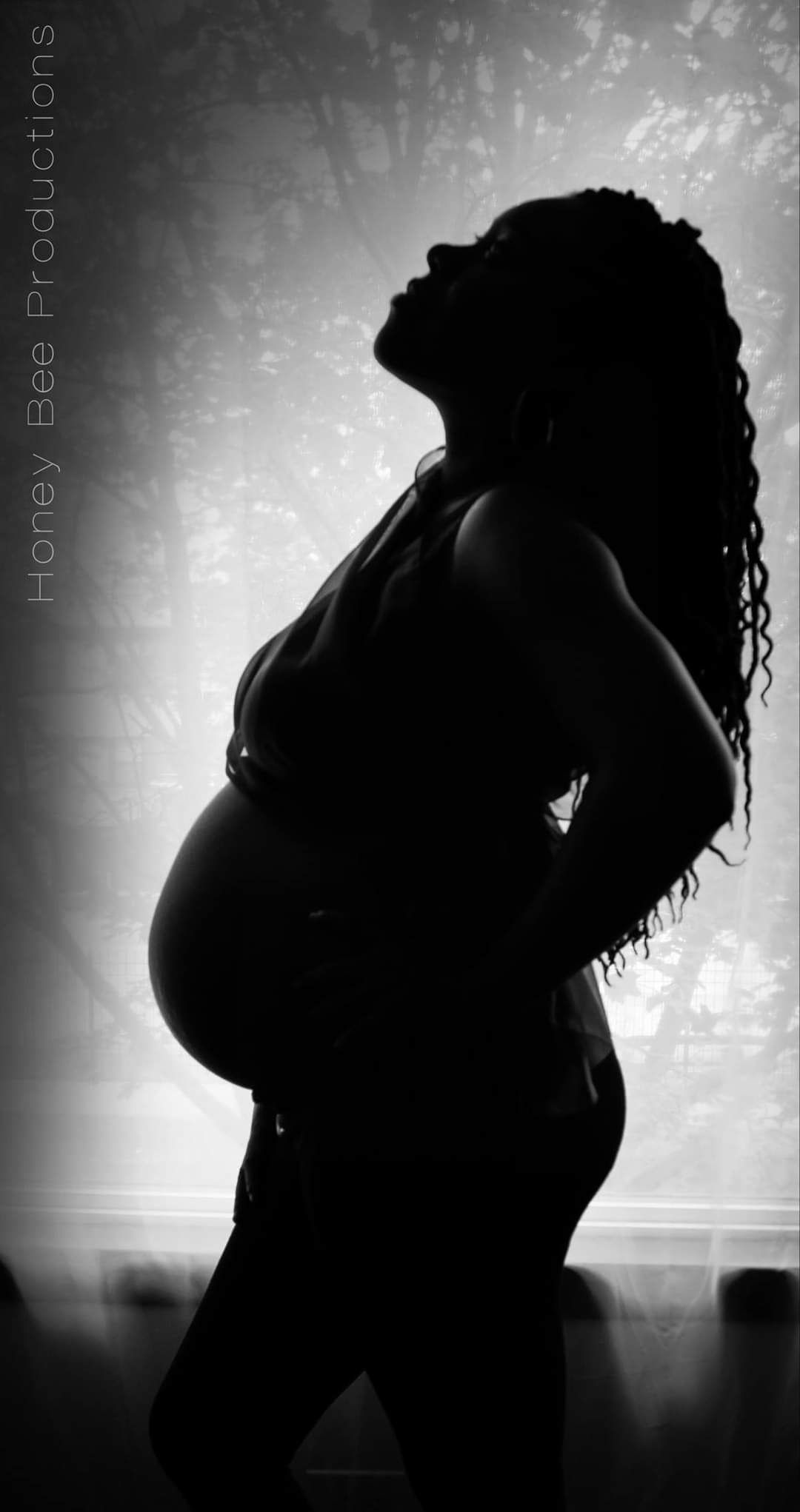 Black and white maternity silhouette photo.