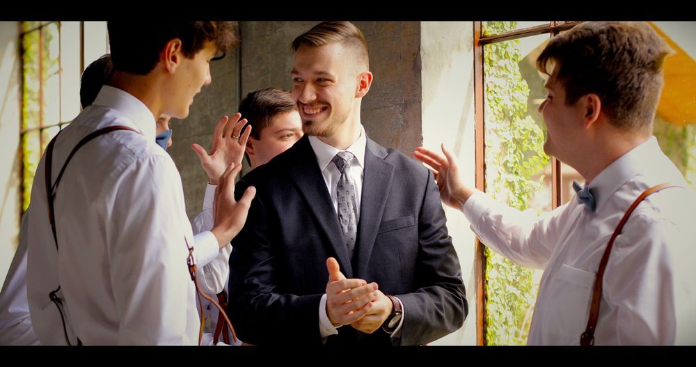 Groom and Groomsmen Pat on the Back Getting Ready Fun Playful