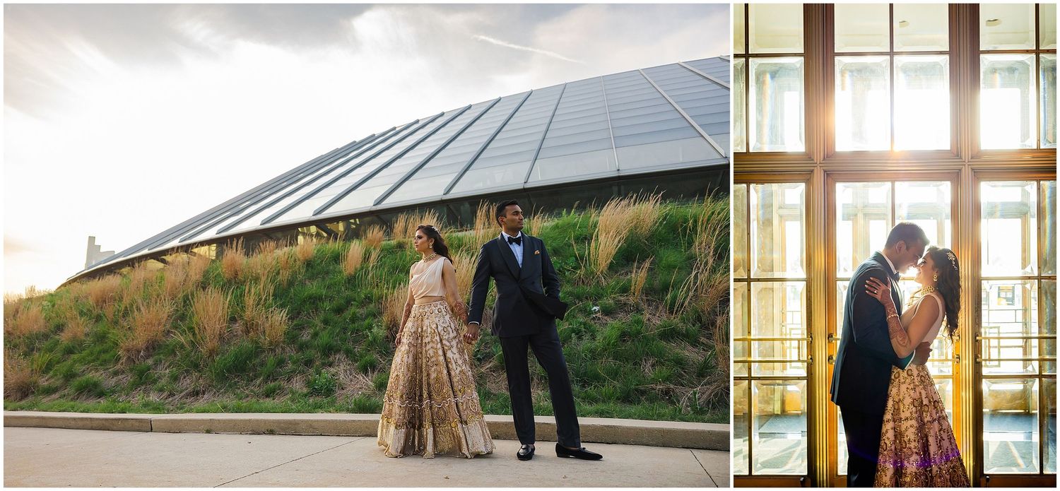 Couple in formal attire stands near modern architecture with geometric glass features.