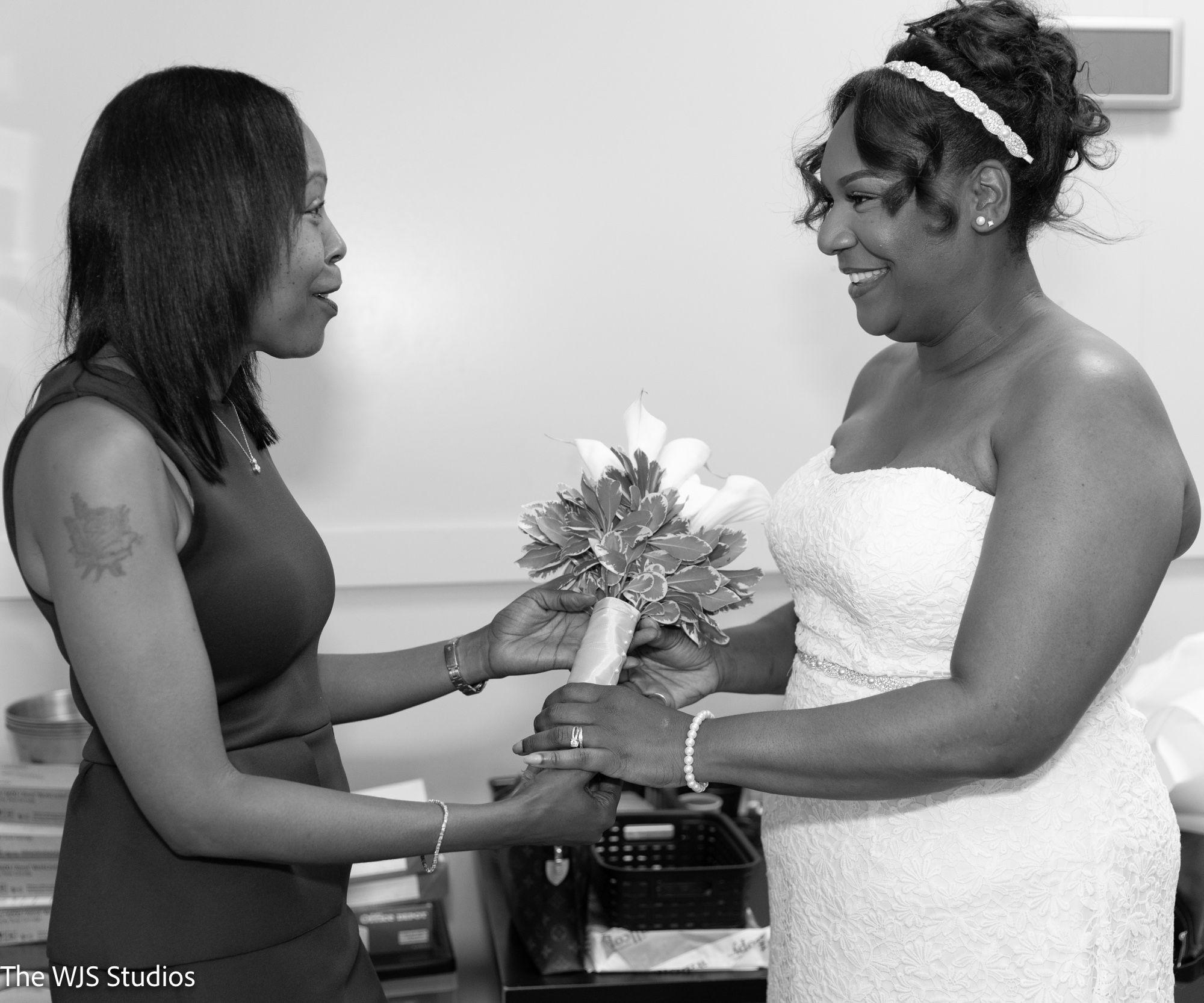 Mrs. Chester getting bouquet from her sister