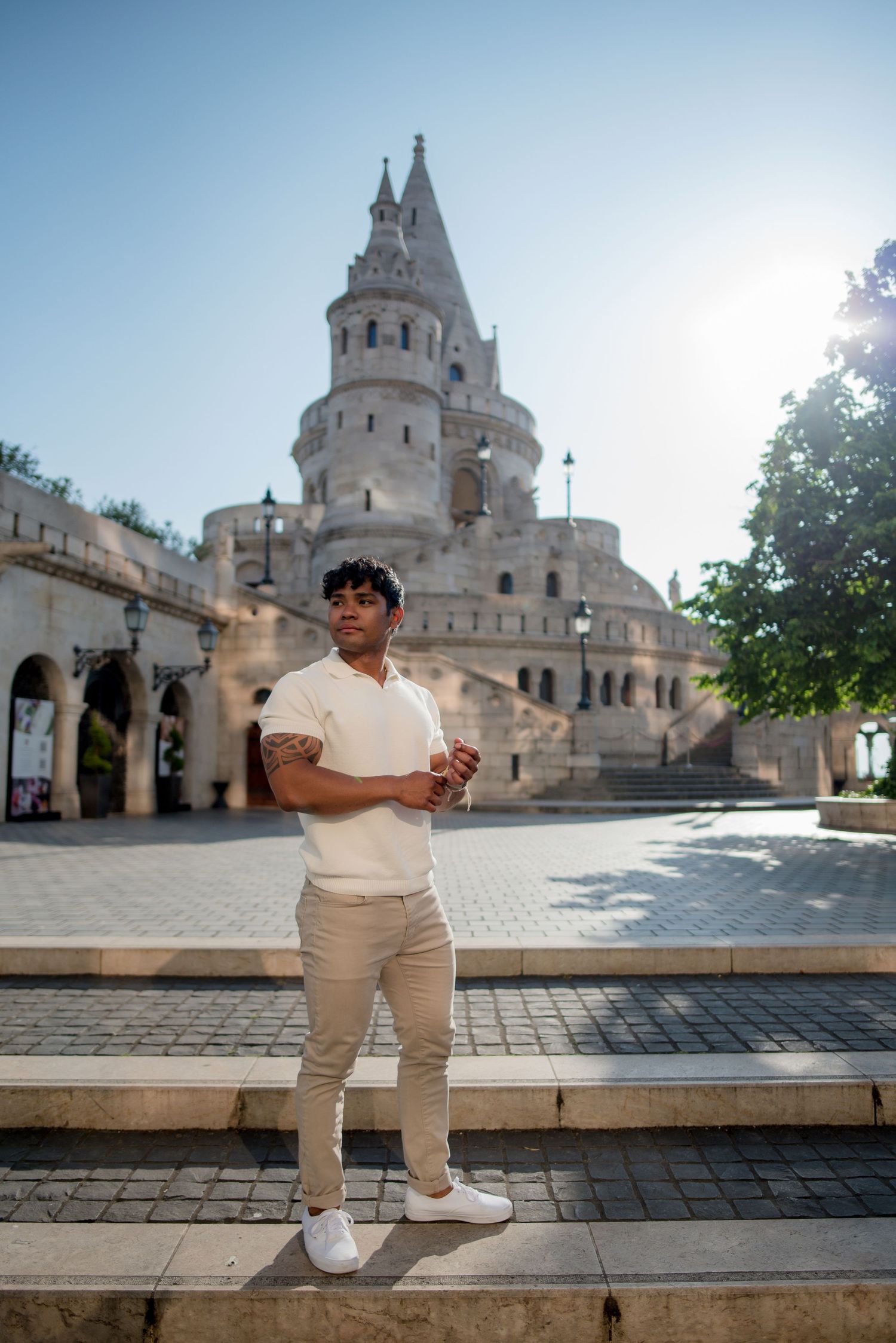 solo traveler posing in front of fisherman's bastion for a photo shoot during sunrise