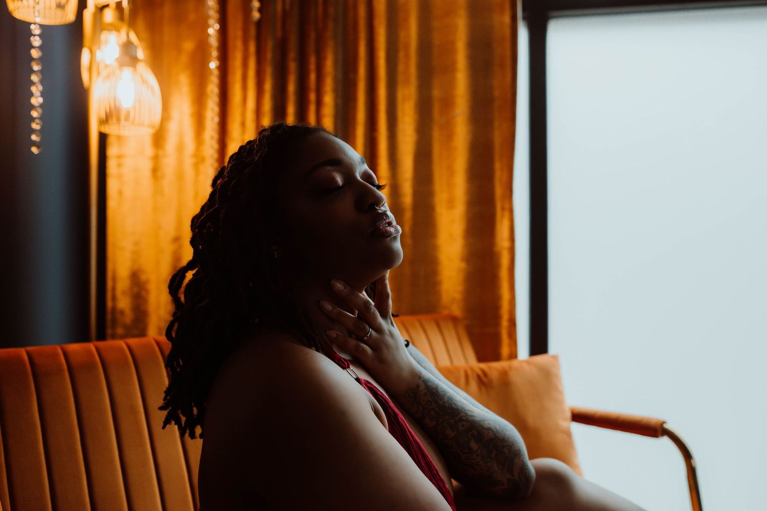 Beautiful black woman boudoir photography session by Boudoir by KJ