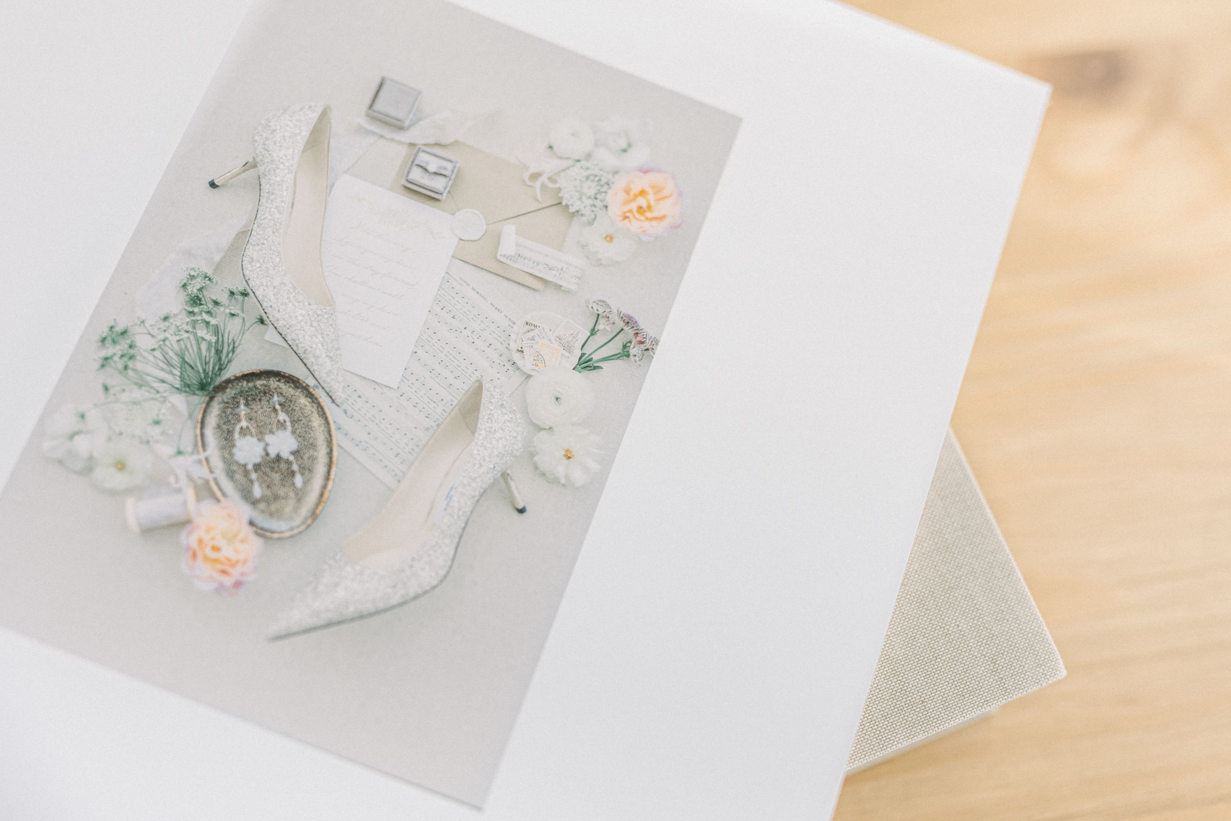 Wedding album page showing delicate jewelry and decorative elements.