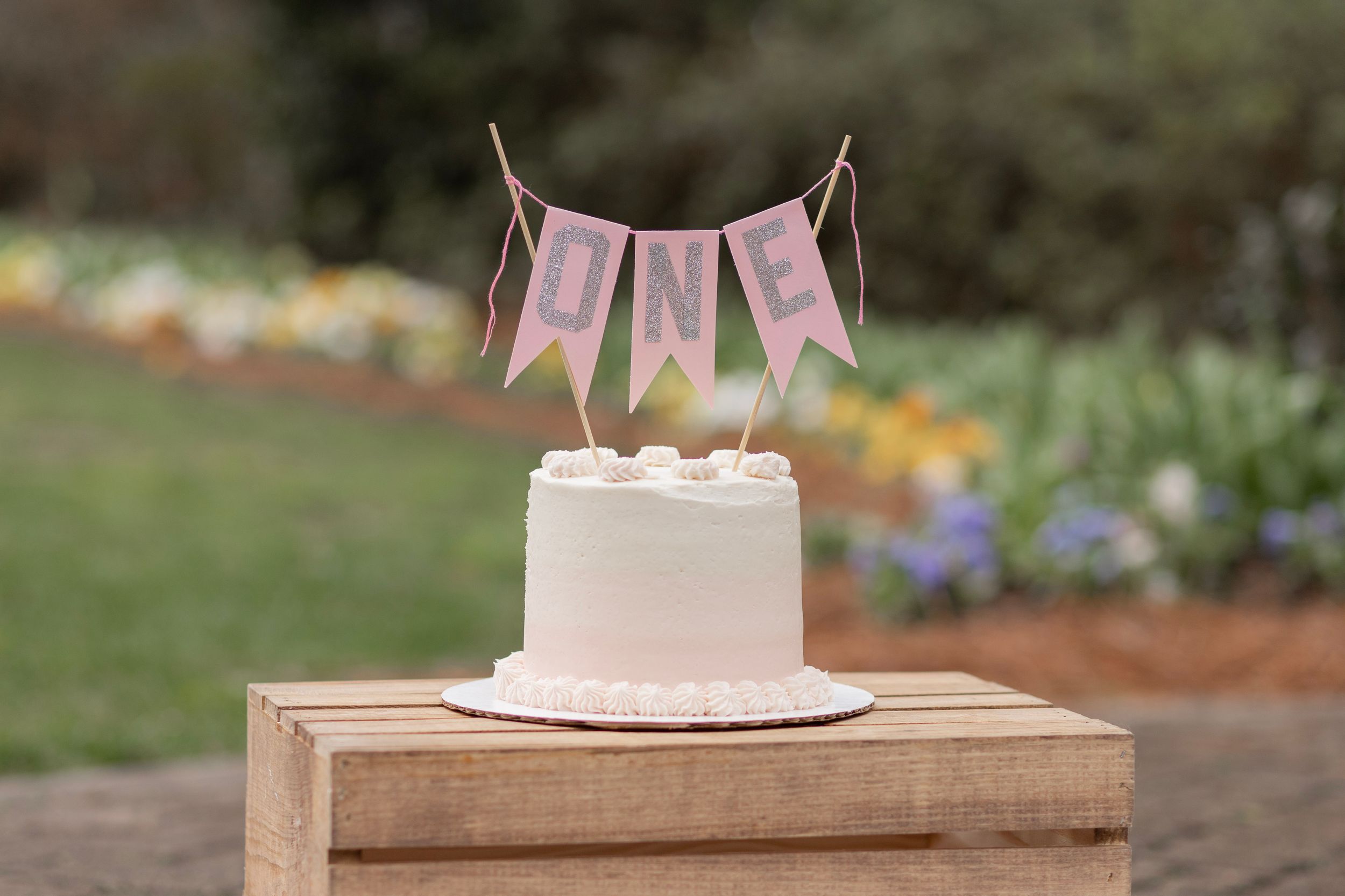 A photography cake smash set up for a one year old girl.
