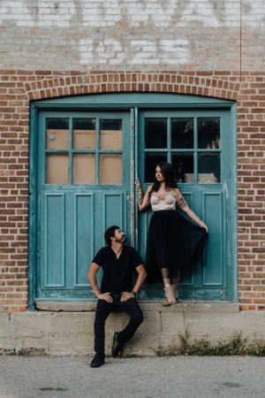 alternative engagement couple in rustic setting