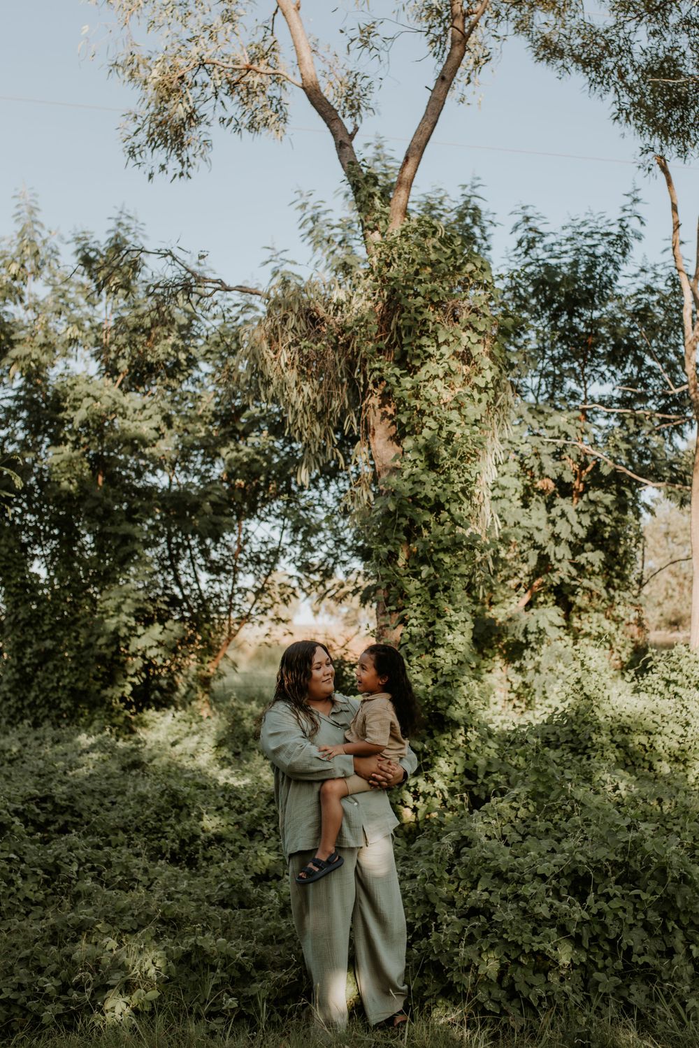Mother and son enjoy the greenery during Mount Isa's wet season