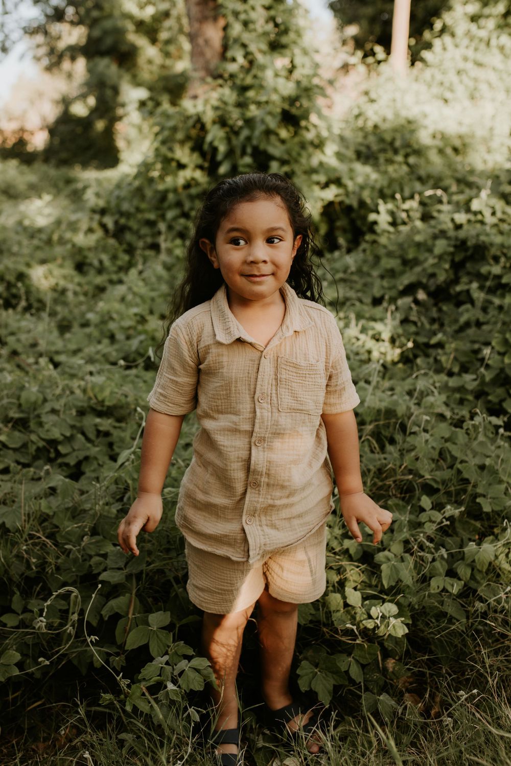 Young boy excited to see green bushes in Mount Isa