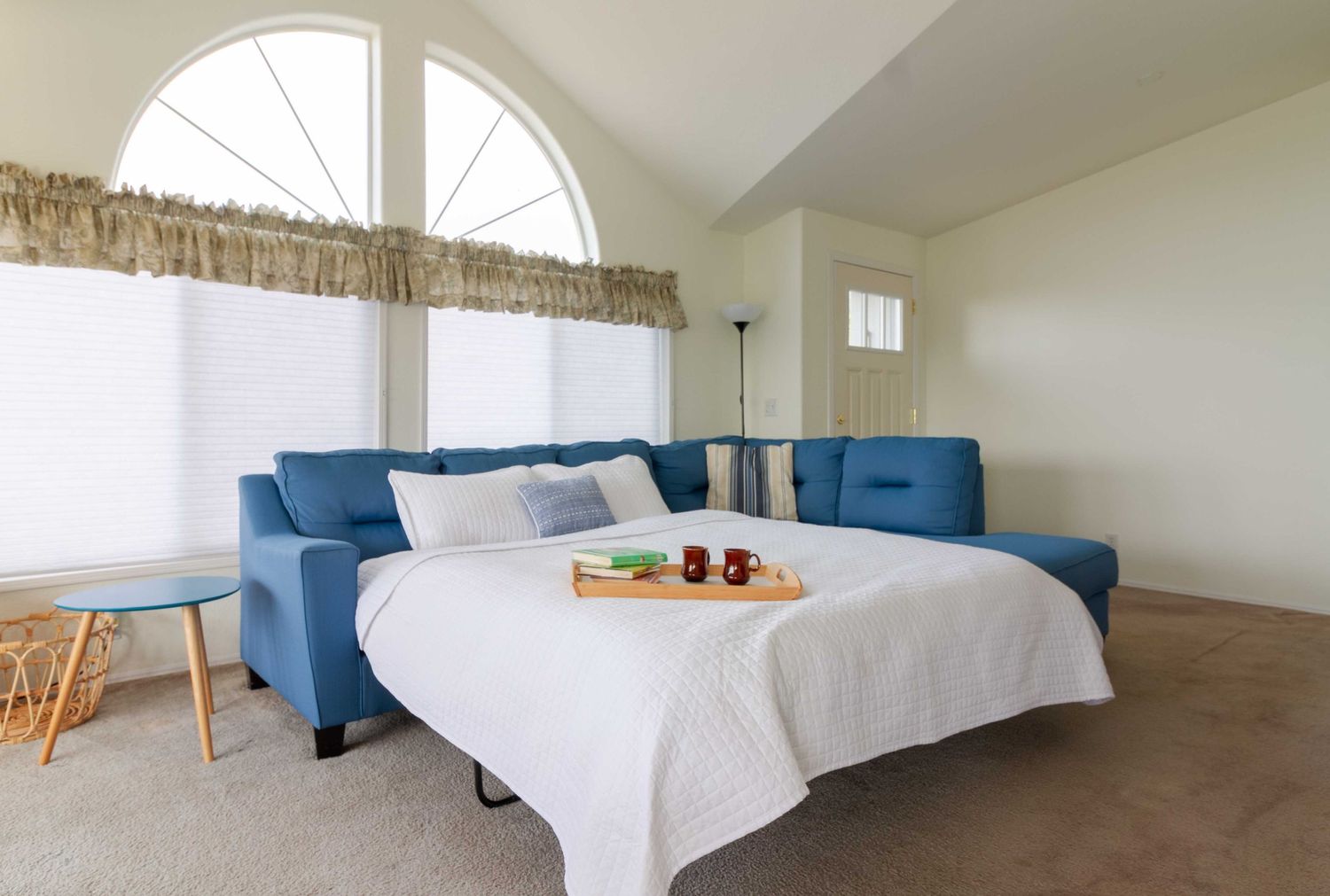 Taylor Carpenter Photography capturing spacious bedspread of Gold Beach, Oregon vacation rental house
