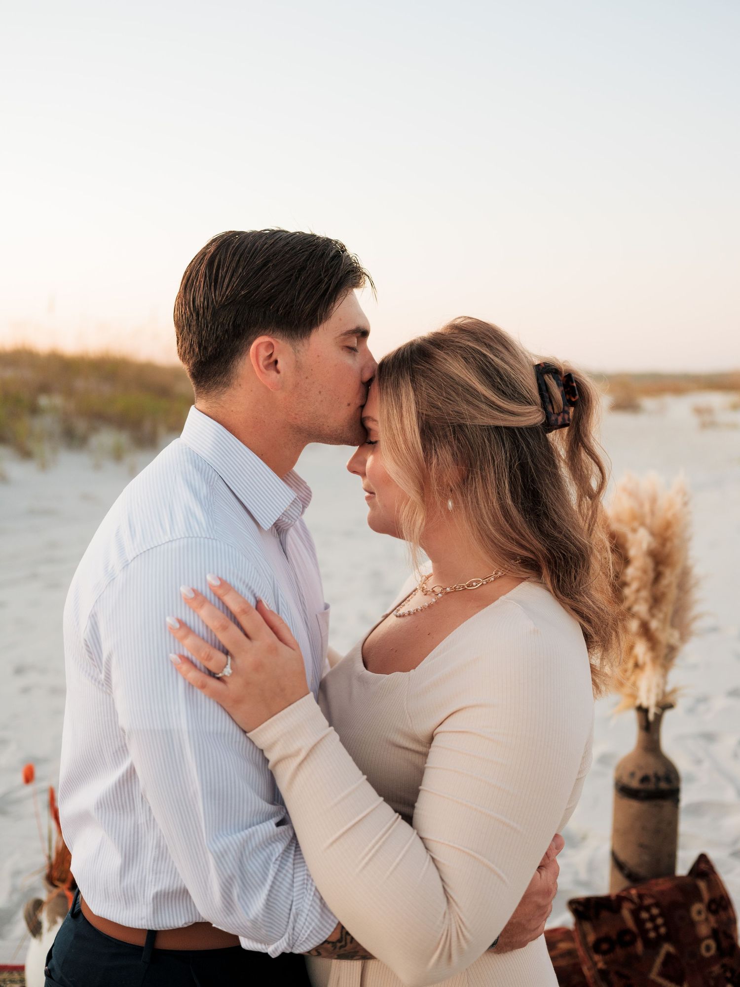 couples propose on the beach