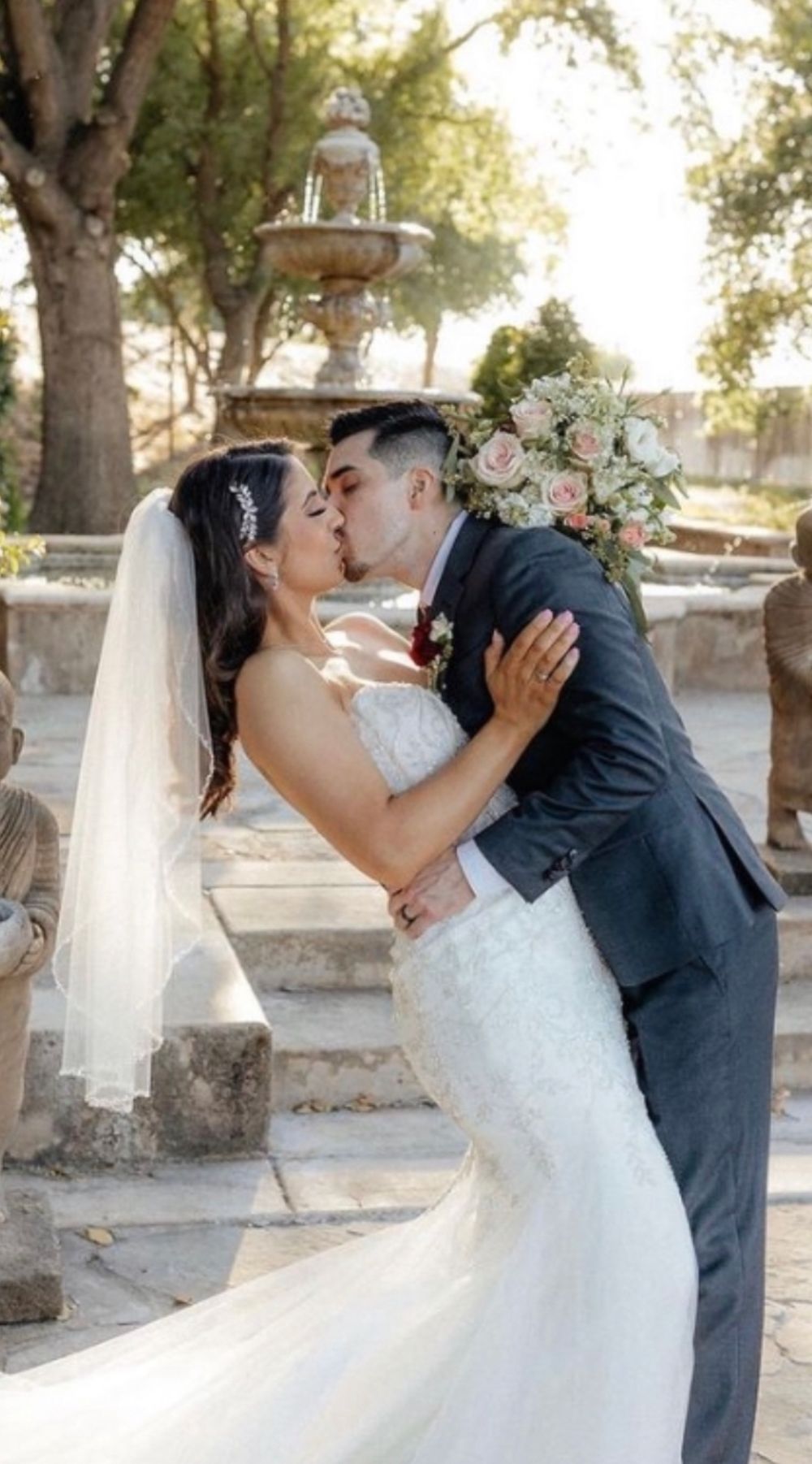 Wedding photographer capturing a kiss at The River Mill in French Camp California