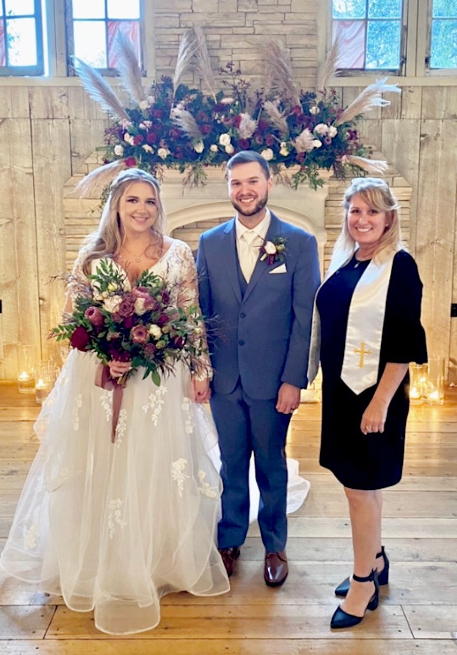 A beautiful couple, united in love, stands before a cozy fireplace on their special day. #WeddingDay