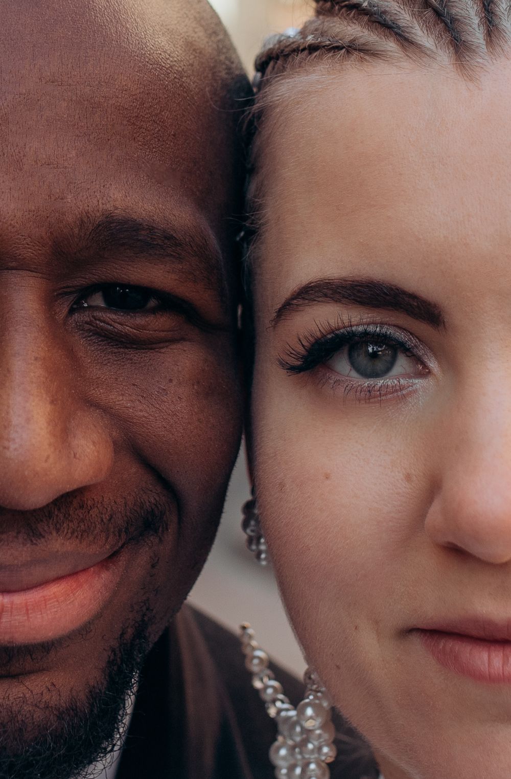 Close up portrait showing contrasting skin tones and loving expressions.