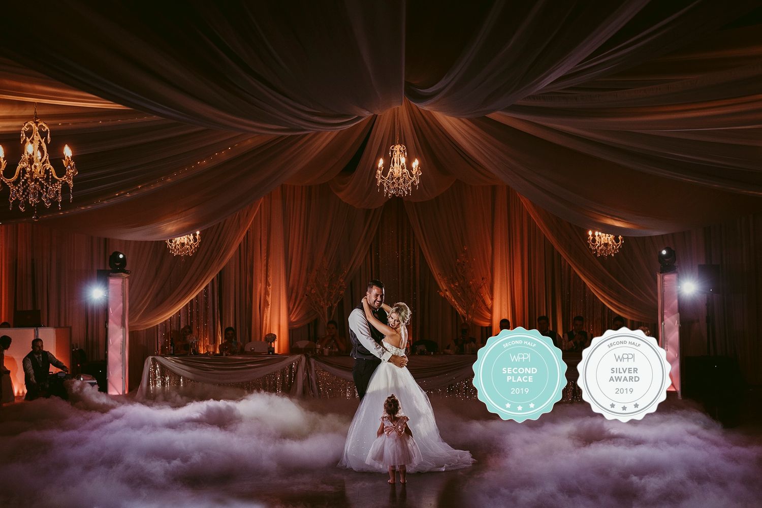 Romantic ballroom wedding dance scene with fog and dramatic orange lighting.