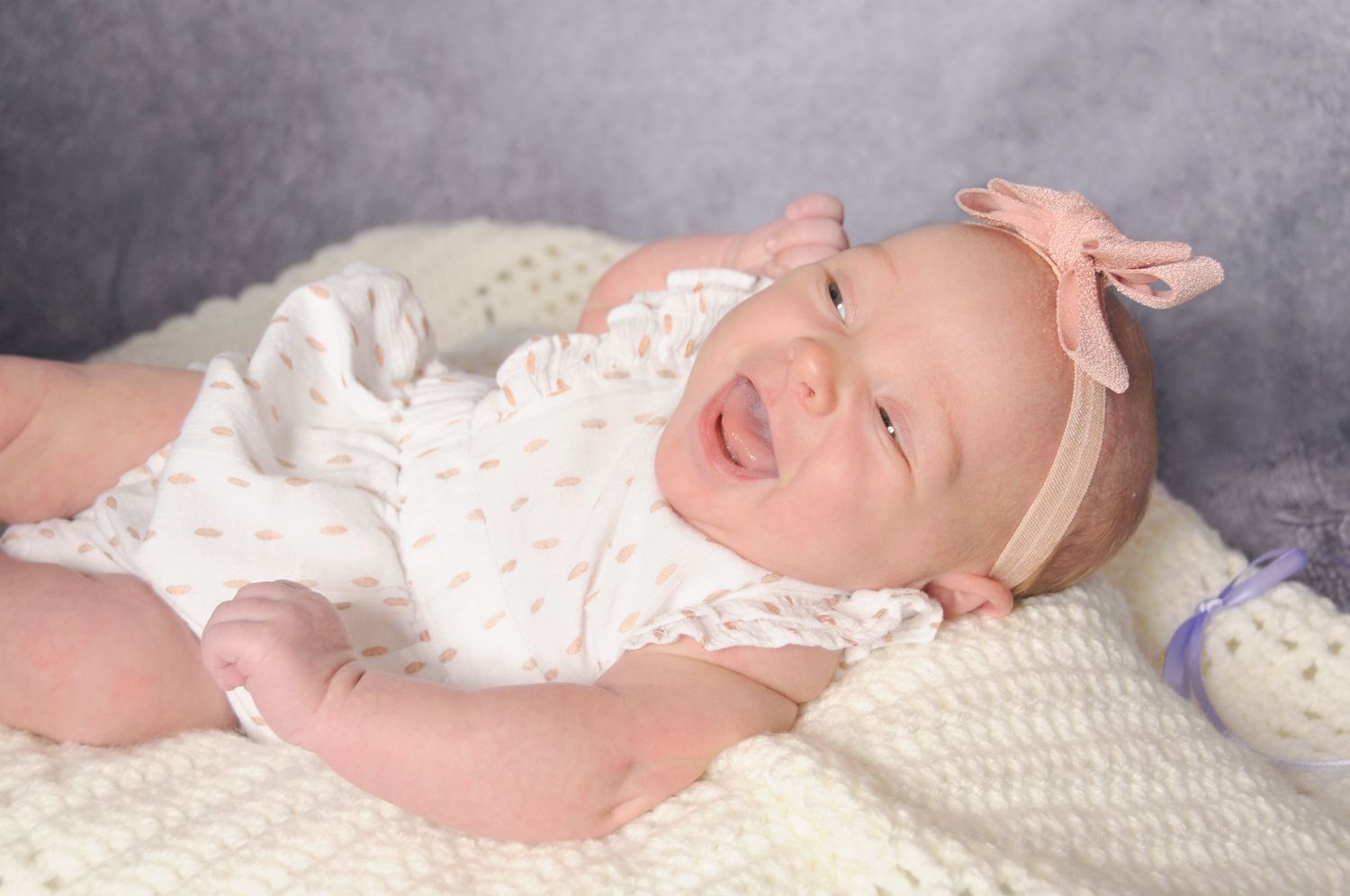 Newborn baby laughing photo