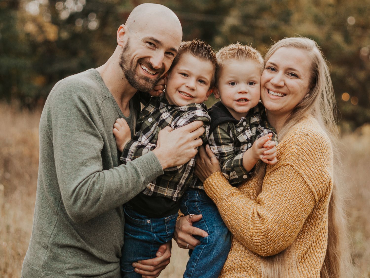 Joyful family portraits showing genuine laughter and embraces in warm autumn light.