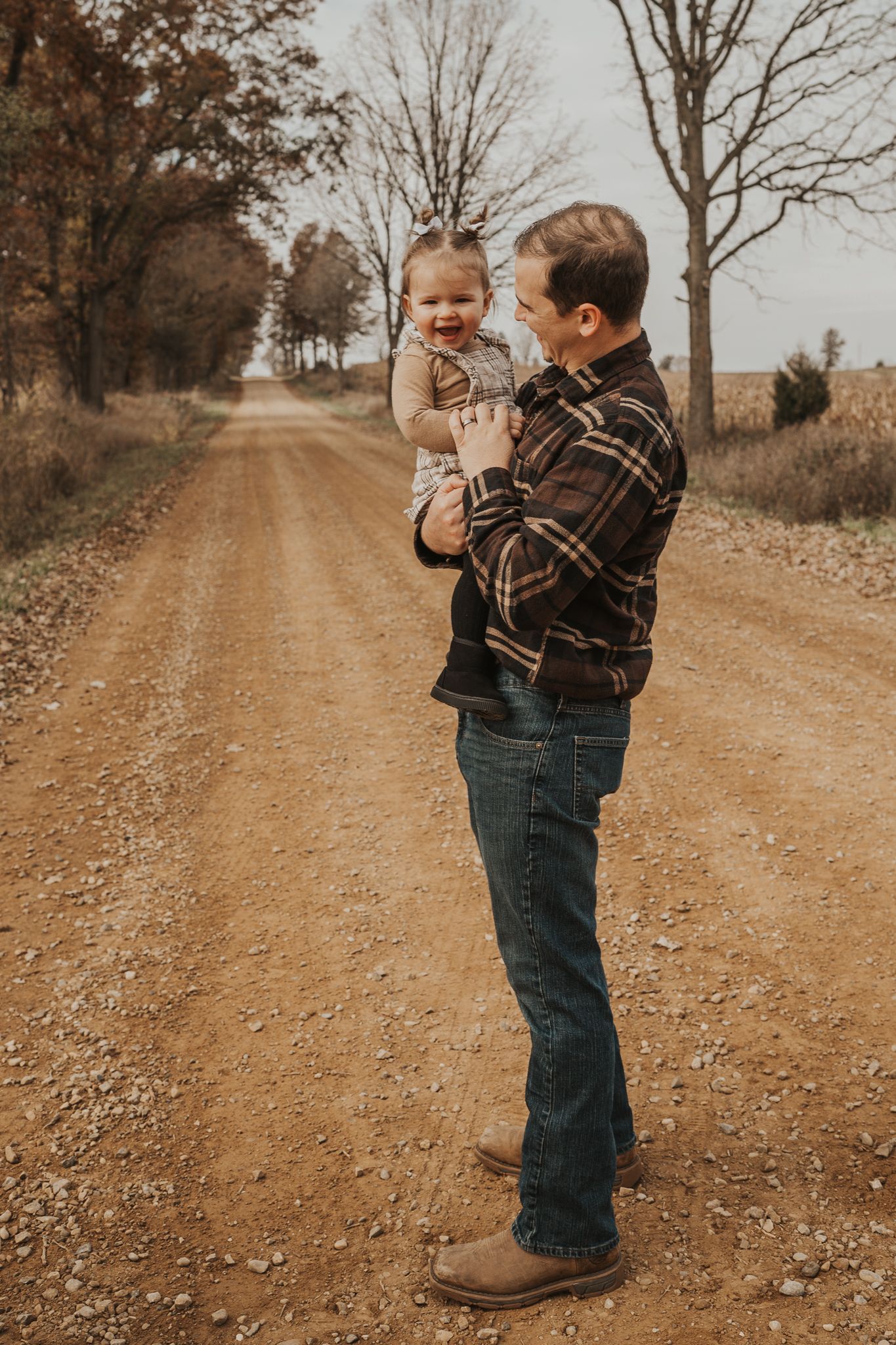 A sweet family moment captured on a rustic country road in Concord Michigan.