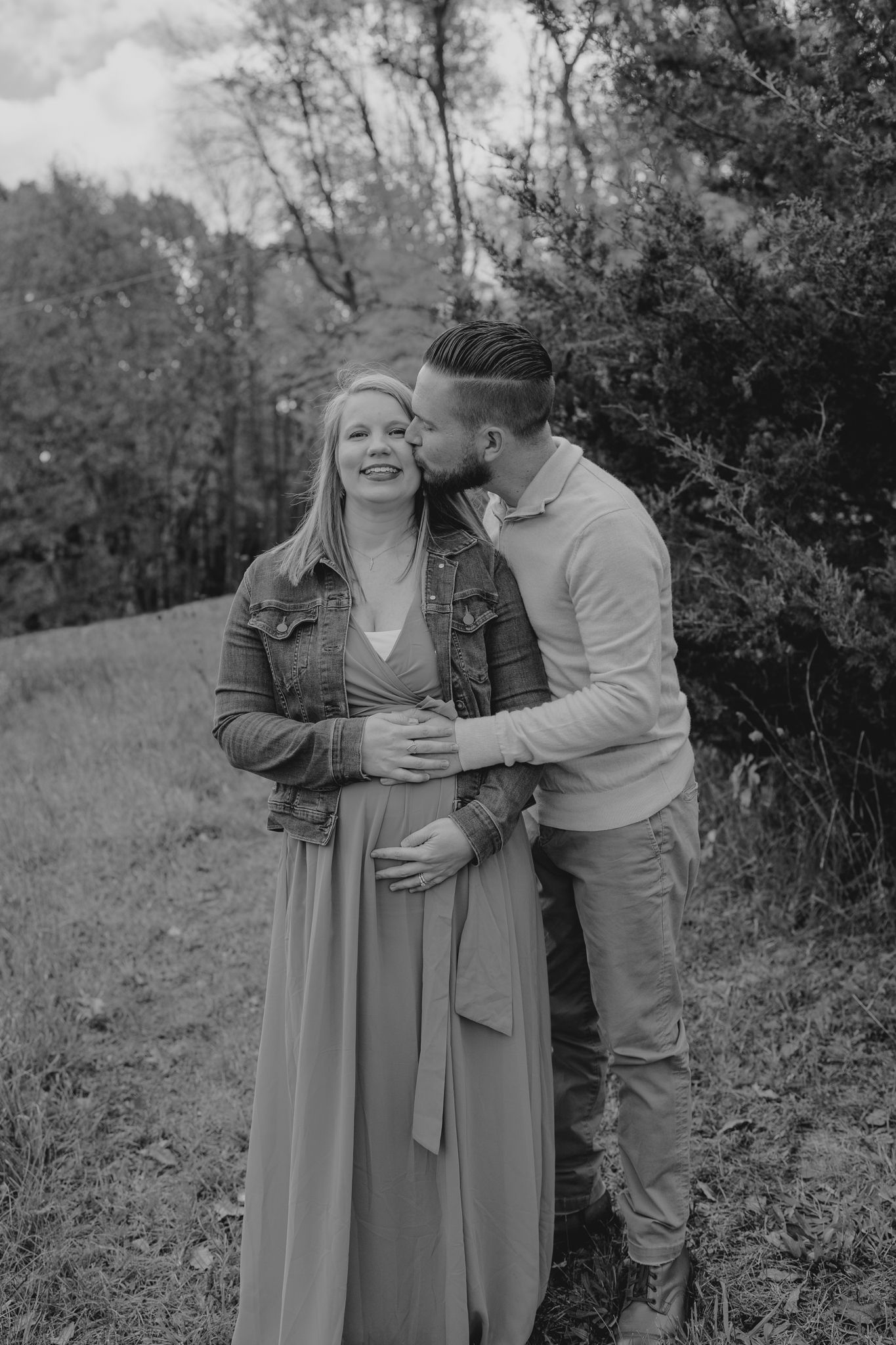 Candid black and white photos showing joyful family moments in nature.