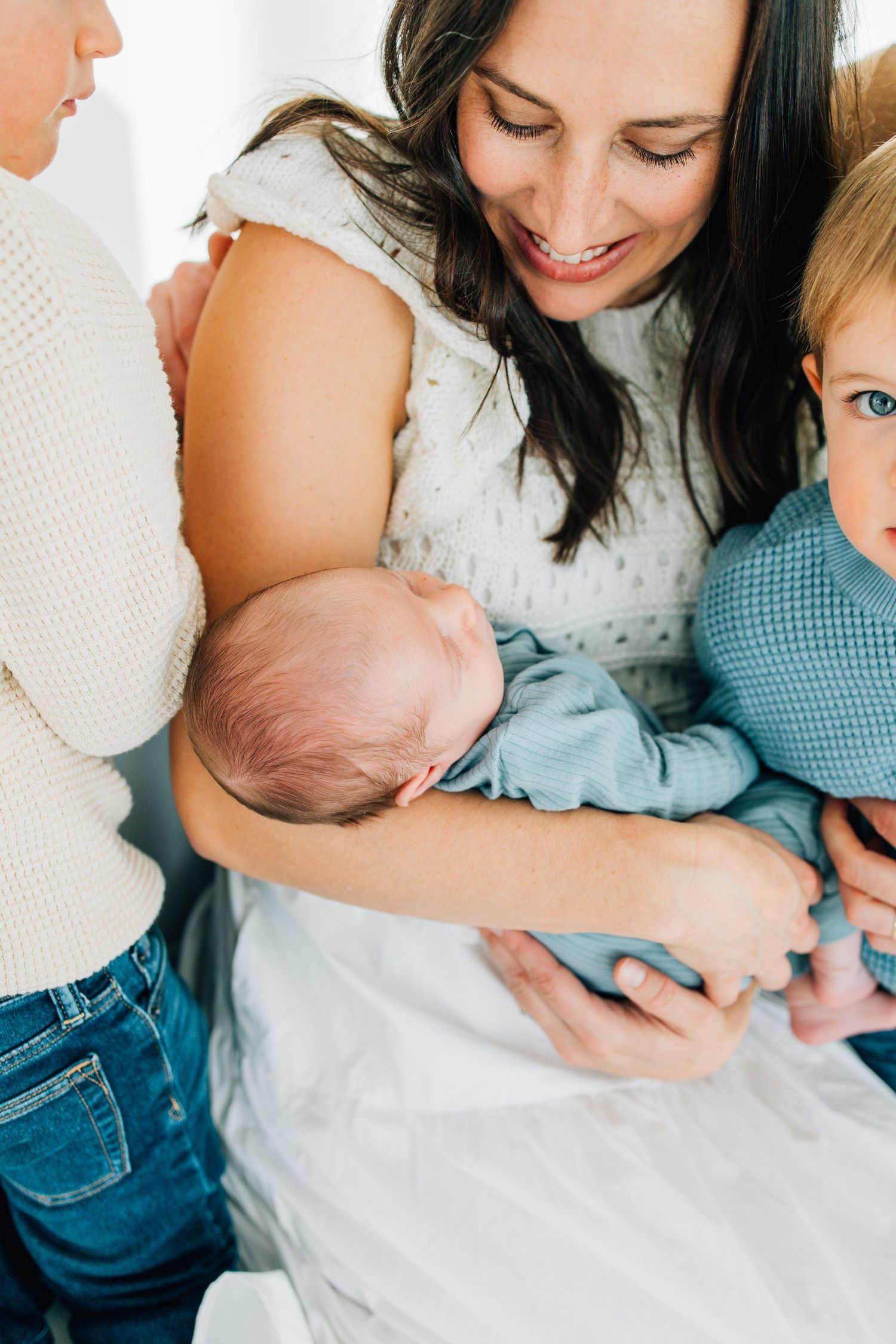 utah newborn photos in moms arms with toddler