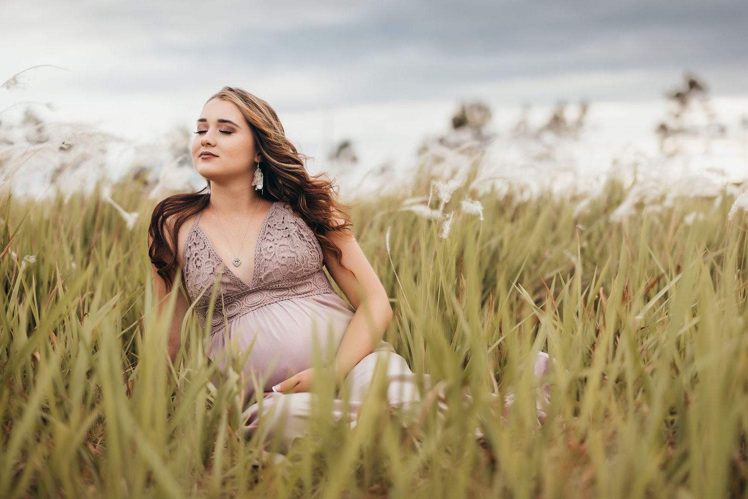 Ashley Baldwin Photography- Family photographer, pregnant girl sitting in the windy field