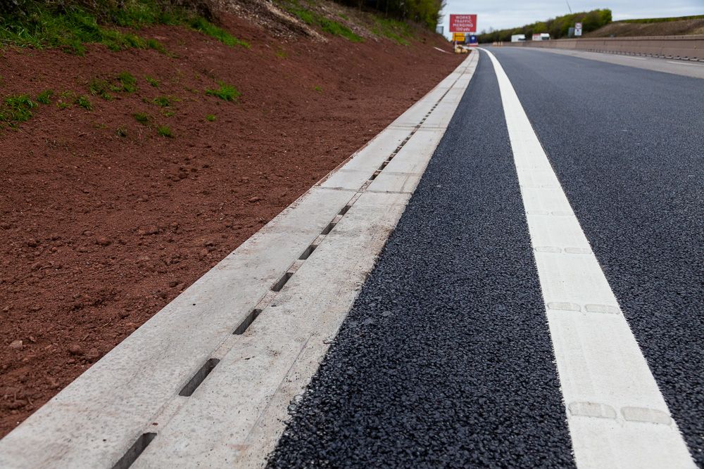 Ground works civil engineering M6 Smart Motorways Tarmac and drainage channels