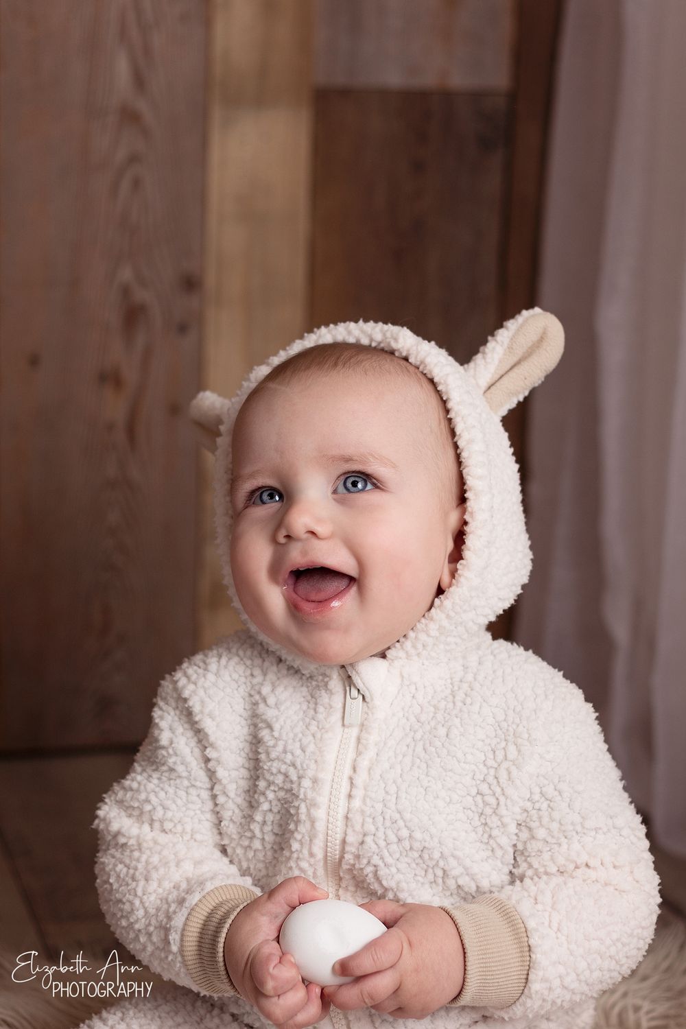 Happy baby wearing a lamb outfit.  Wisconsin Baby Portrait