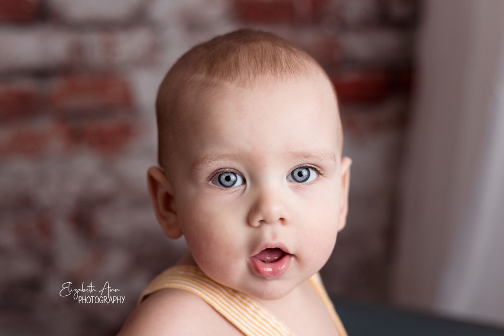 Close up of blue eyed baby boy.  Wisconsin studio portrait