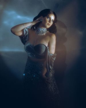 Dark moody fashion portrait with sparkly crystal choker and corset top.