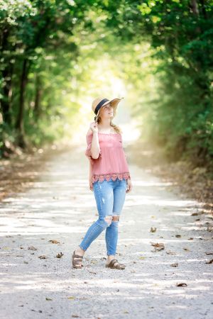 young lady on dirt road