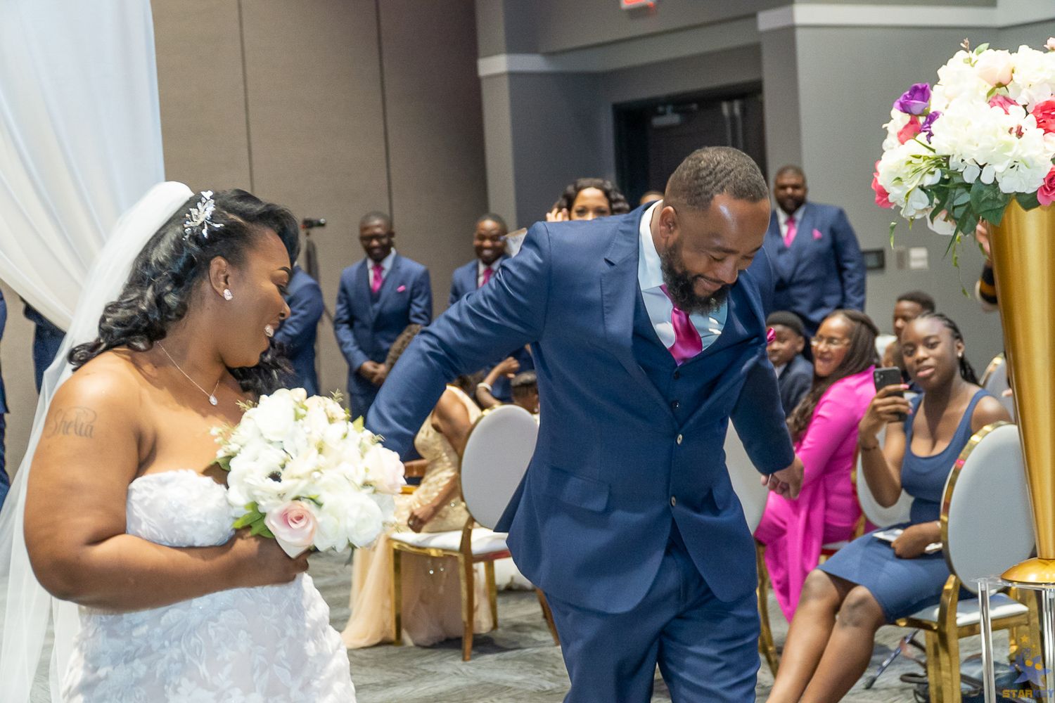Bride and Groom walking down aisle